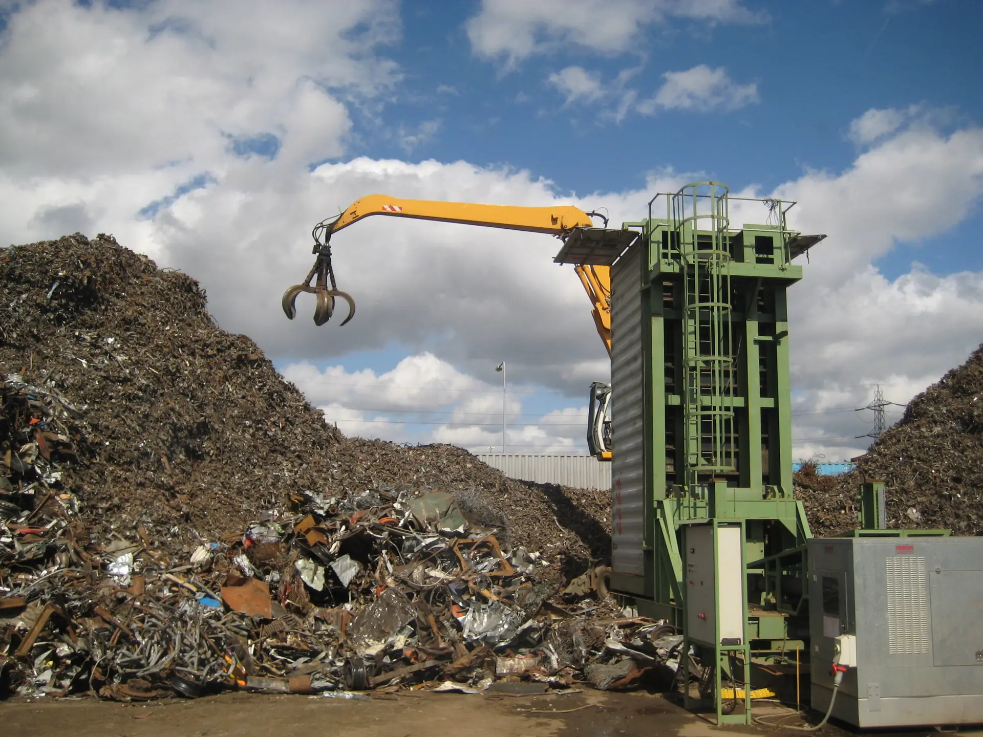 Scrap shear processing ferrous material